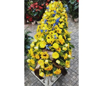 Cofano funebre di fiori gialli e blu