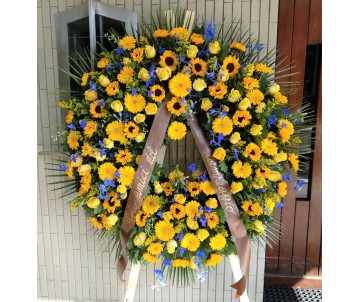 Corona funebre di fiori gialli e blu